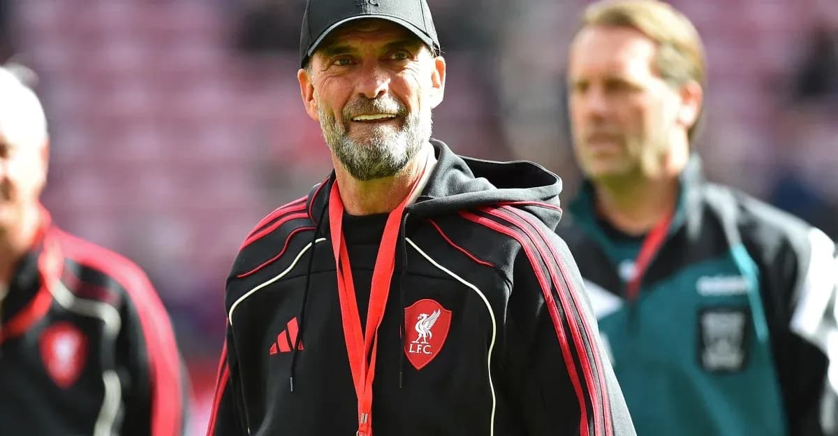 Liverpool manager walking on pitch before match Liverpool manager walking on pitch before match