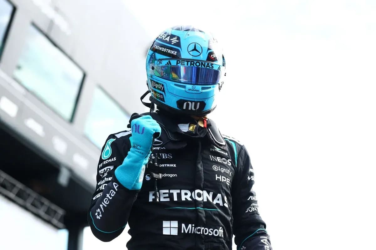 Pilot celebrating after race in Mercedes suit Pilot celebrating after race in Mercedes suit