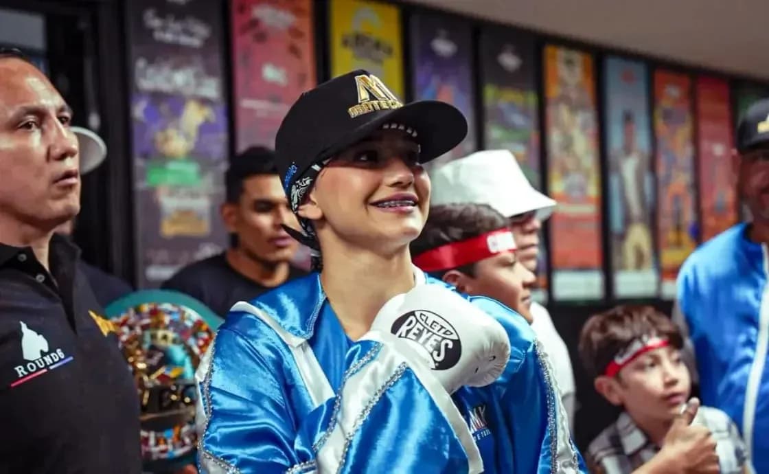 Boxer in blue robe smiling before match Boxer in blue robe smiling before match