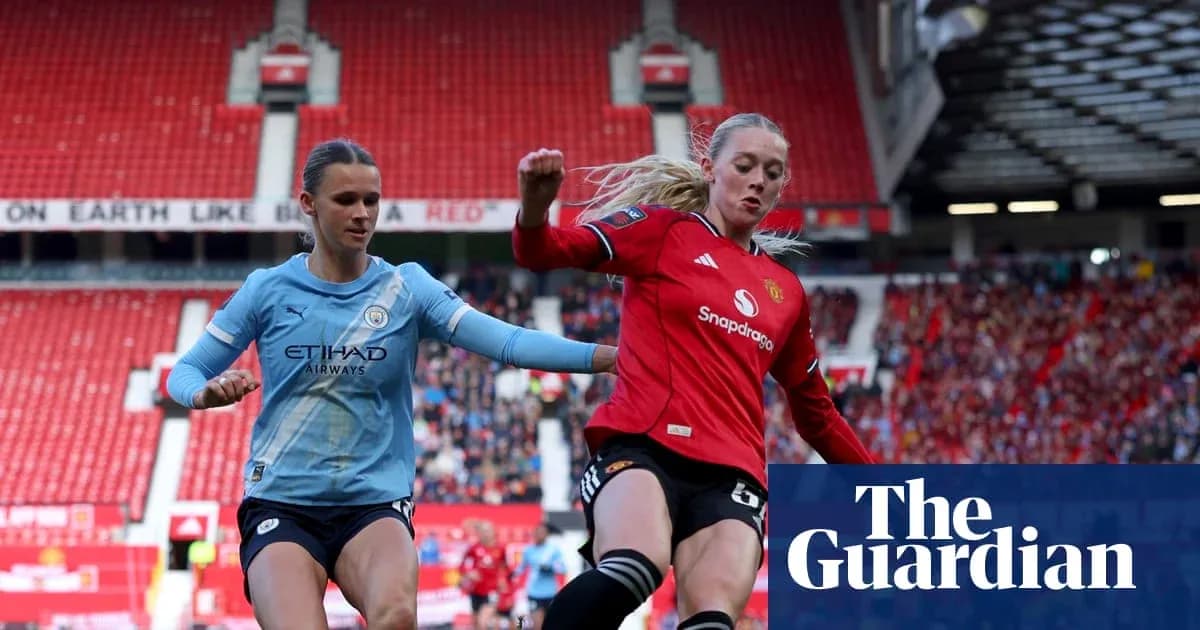 Two female football players competing for the ball Two female football players competing for the ball