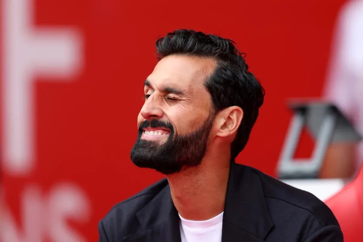 Man smiling with a red background behind him Man smiling with a red background behind him