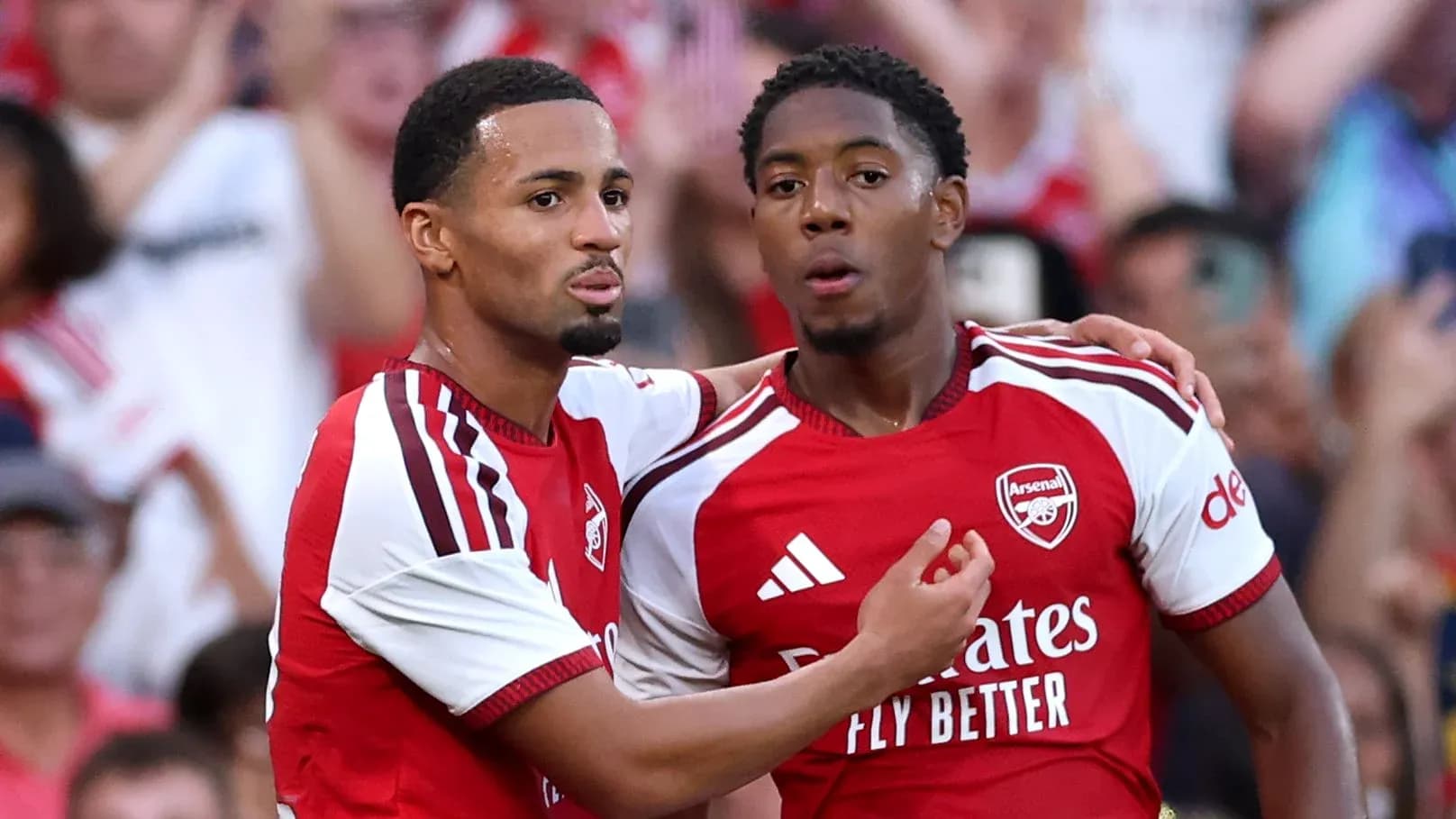 Arsenal players celebrating a goal together Arsenal players celebrating a goal together