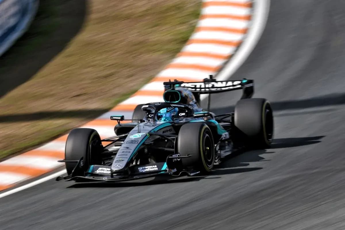 Mercedes Formula 1 car navigating a racetrack corner Mercedes Formula 1 car navigating a racetrack corner
