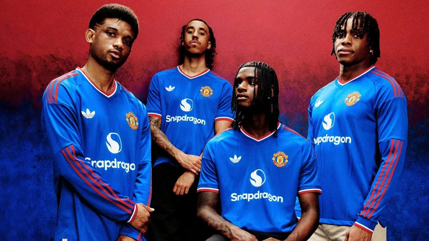 Four players posing in Manchester United jerseys Four players posing in Manchester United jerseys