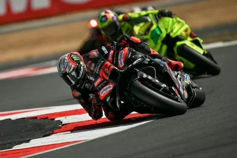 Motorcyclists racing on track during competition Motorcyclists racing on track during competition