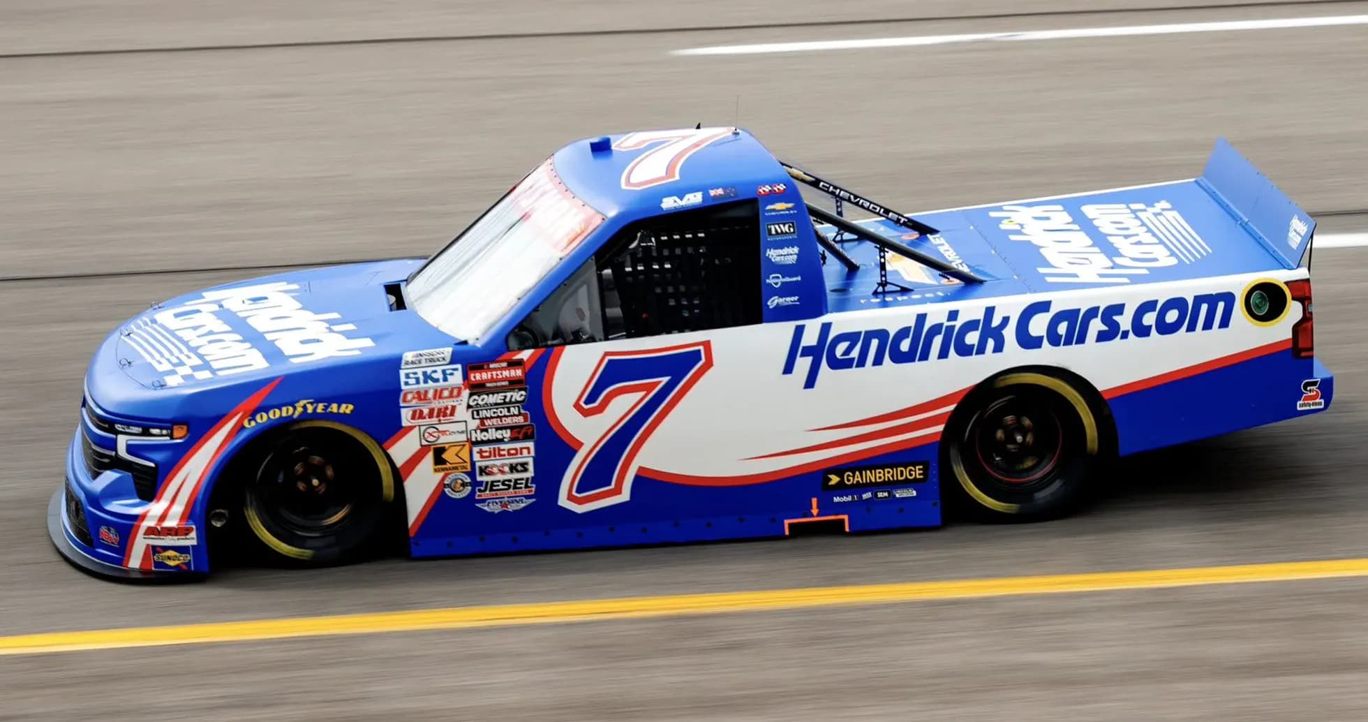 Chevrolet truck racing on track with Hendrick Cars livery Chevrolet truck racing on track with Hendrick Cars livery