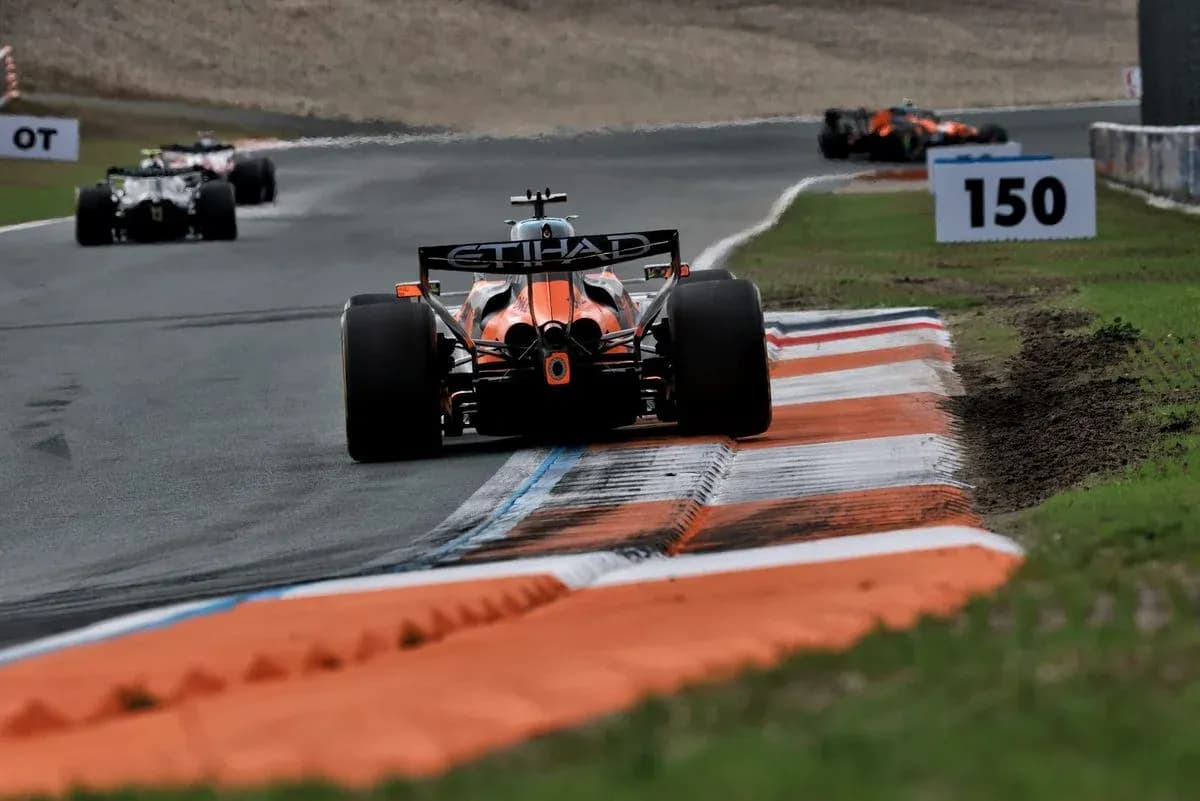 Formula 1 car navigating a racetrack corner Formula 1 car navigating a racetrack corner
