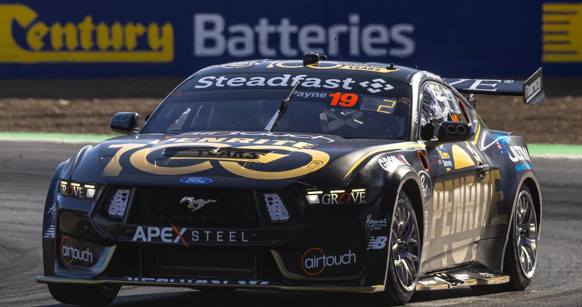 Ford Mustang racing car on track during event Ford Mustang racing car on track during event