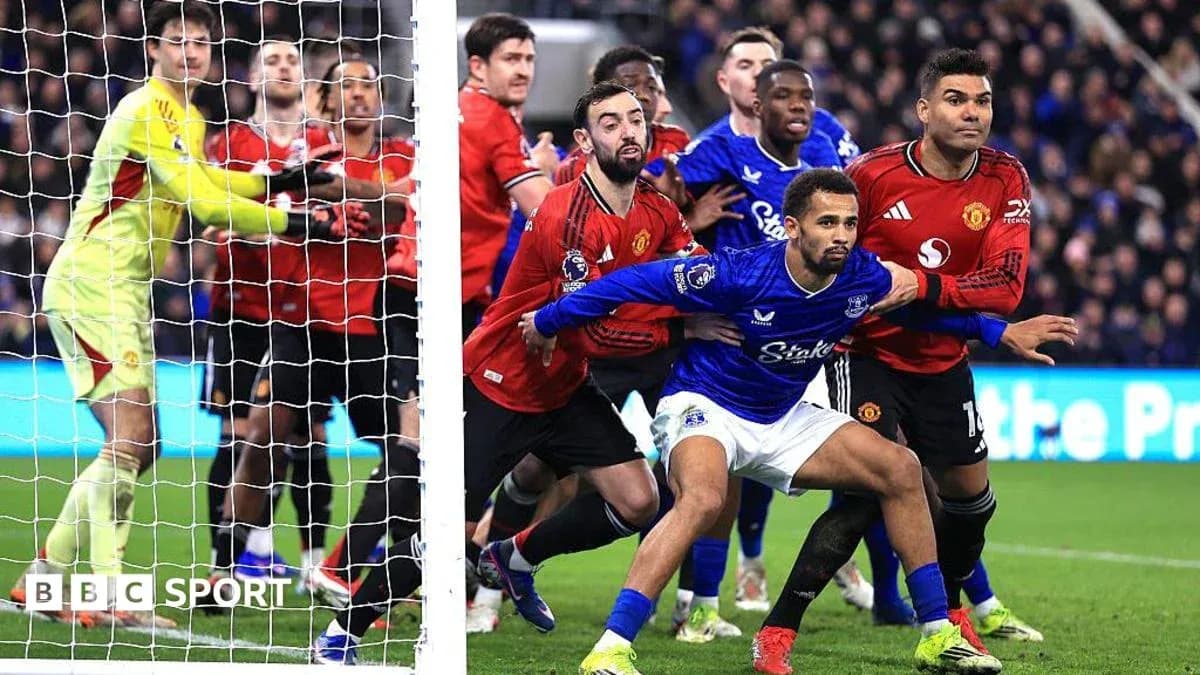Players from Everton and Manchester United near goal Players from Everton and Manchester United near goal