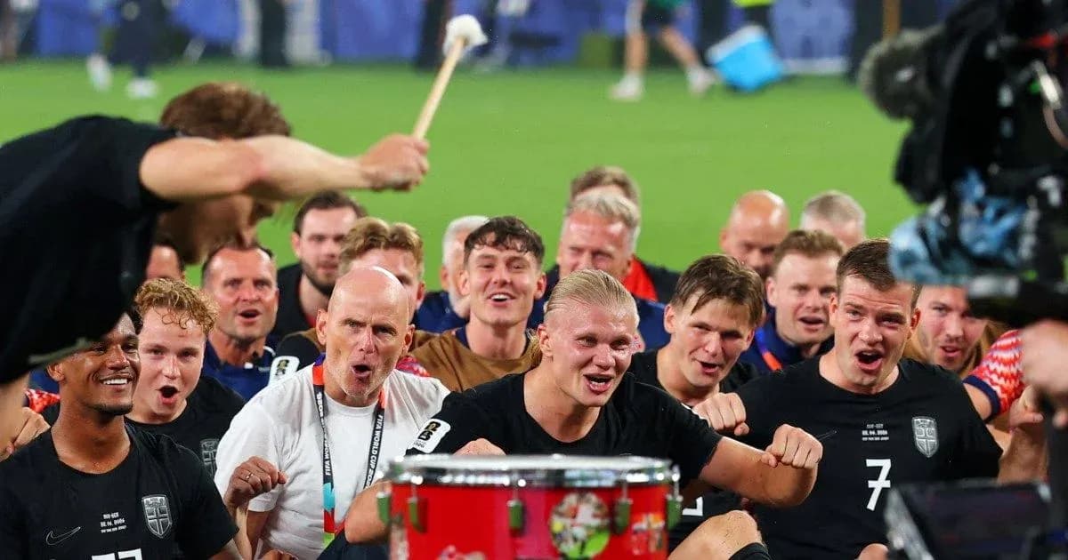 Football team celebrating with drum after match Football team celebrating with drum after match