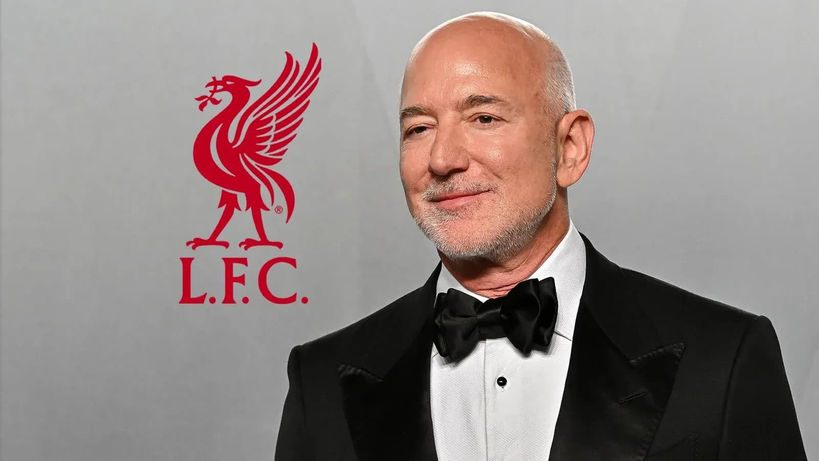 Man in tuxedo with Liverpool FC logo background Man in tuxedo with Liverpool FC logo background