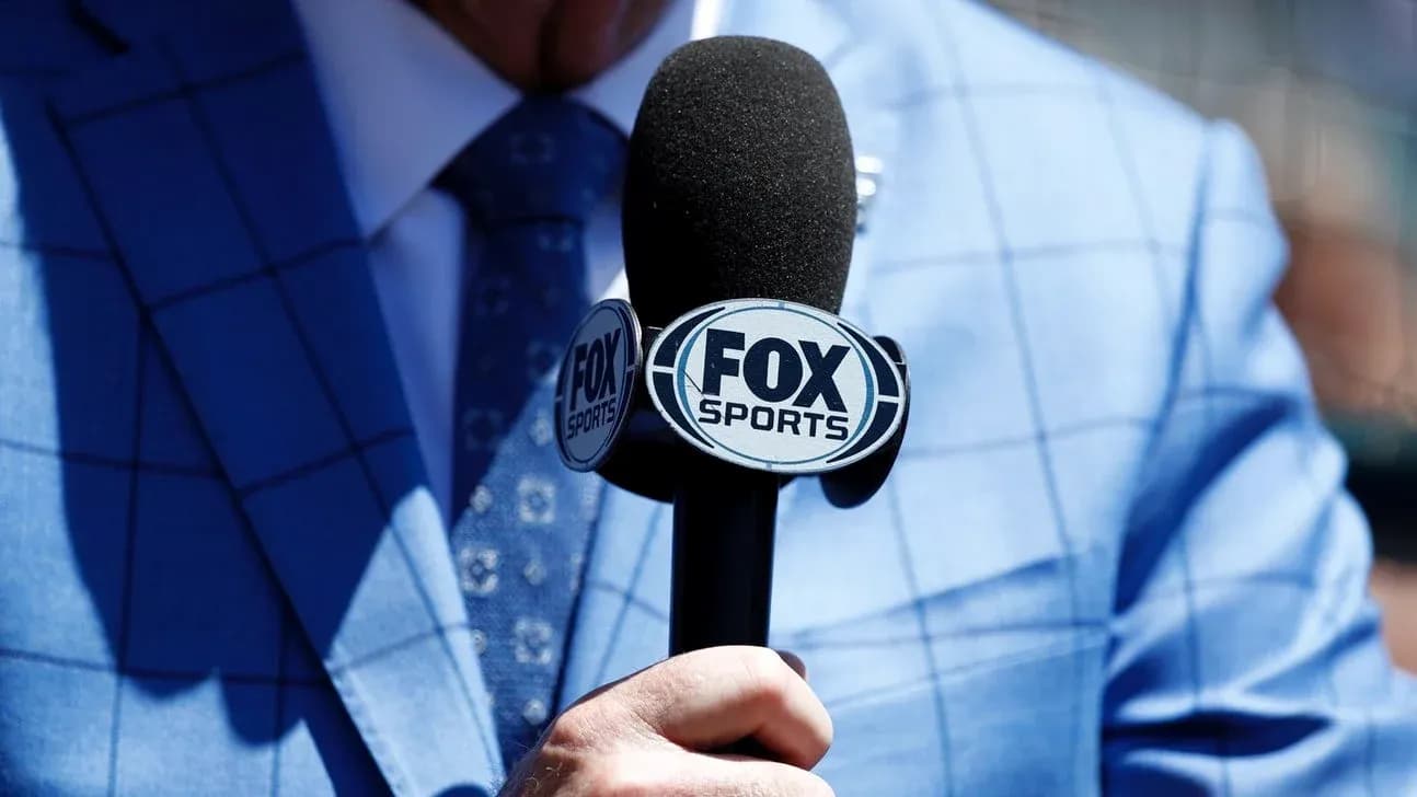 Mic with FOX Sports logo held by presenter Mic with FOX Sports logo held by presenter