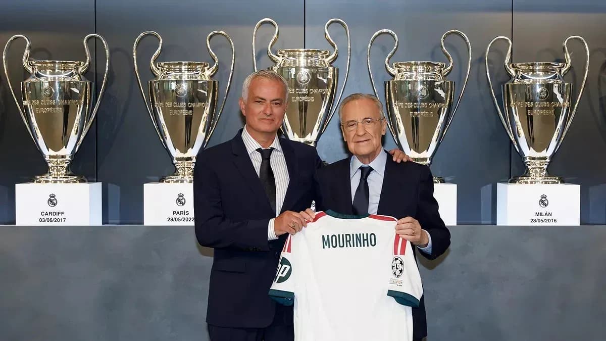 Mourinho and president holding jersey with trophies Mourinho and president holding jersey with trophies