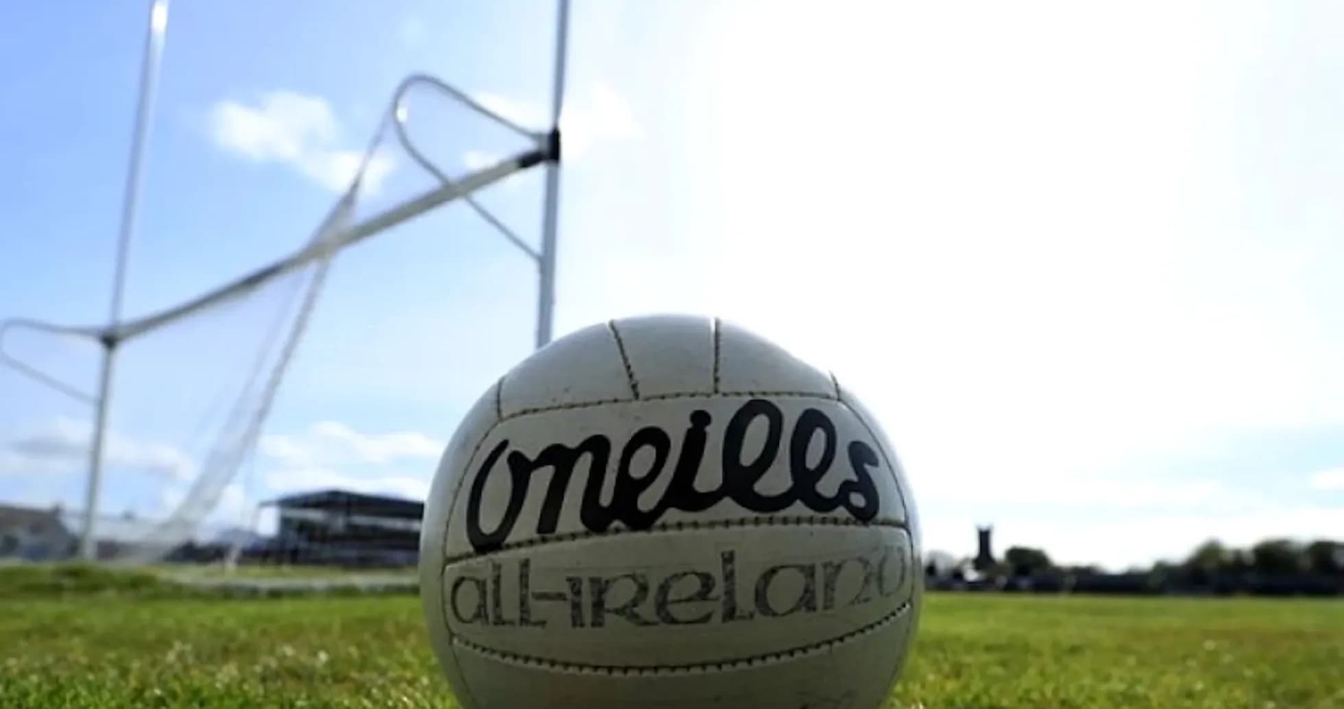 GAA football on field near goalposts GAA football on field near goalposts