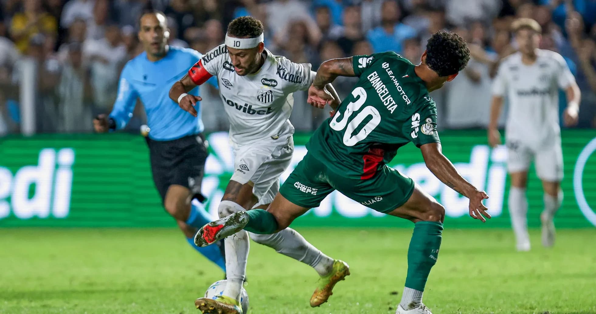 Neymar dribbling past defender during football match Neymar dribbling past defender during football match