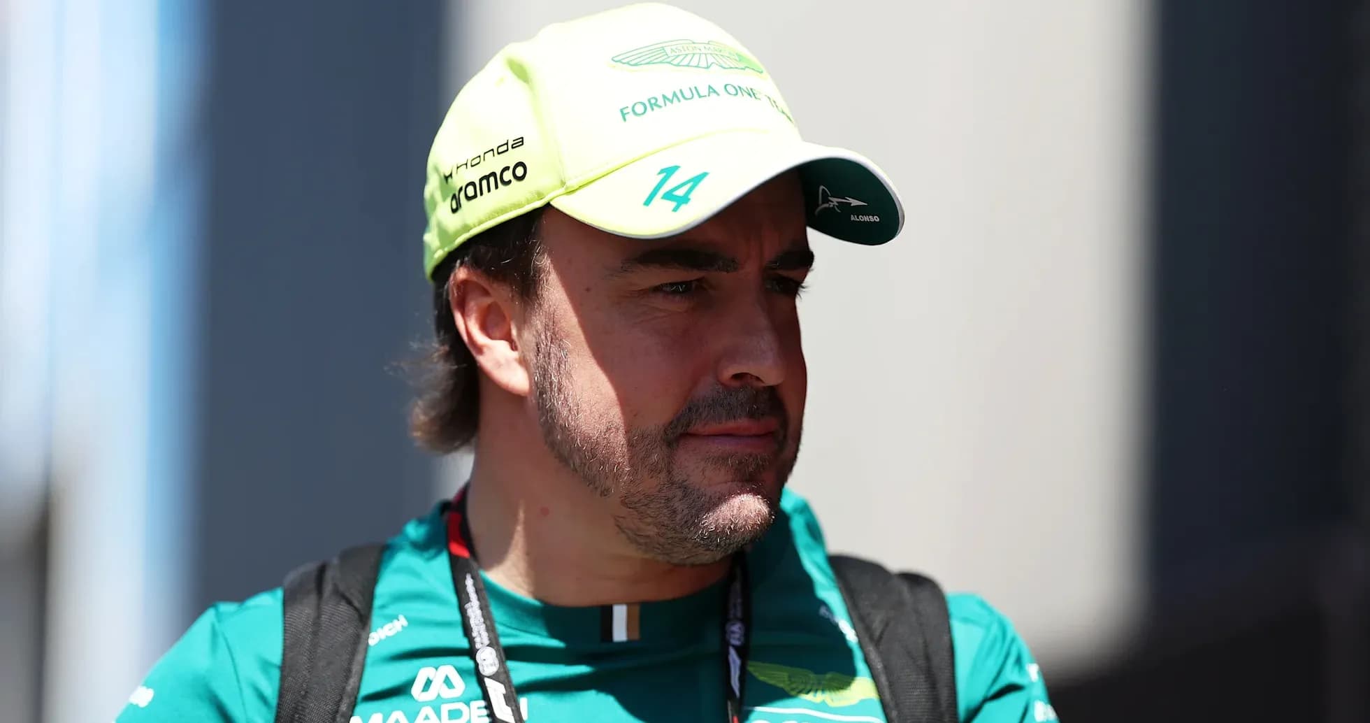 F1 driver wearing Aston Martin cap and team uniform F1 driver wearing Aston Martin cap and team uniform