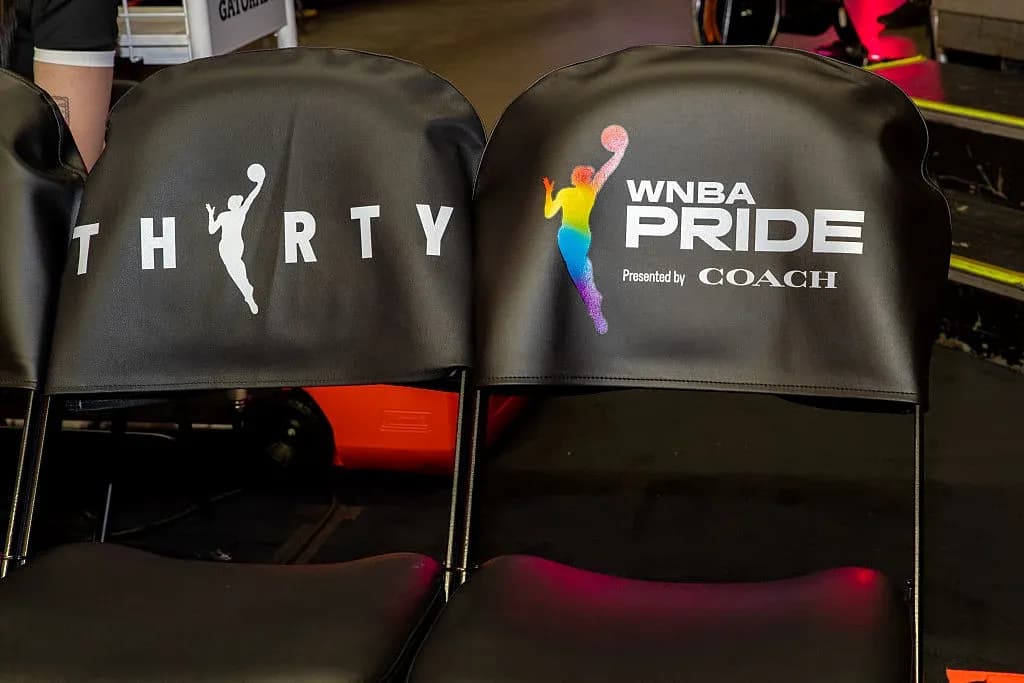 Chairs with WNBA Pride branding at event Chairs with WNBA Pride branding at event
