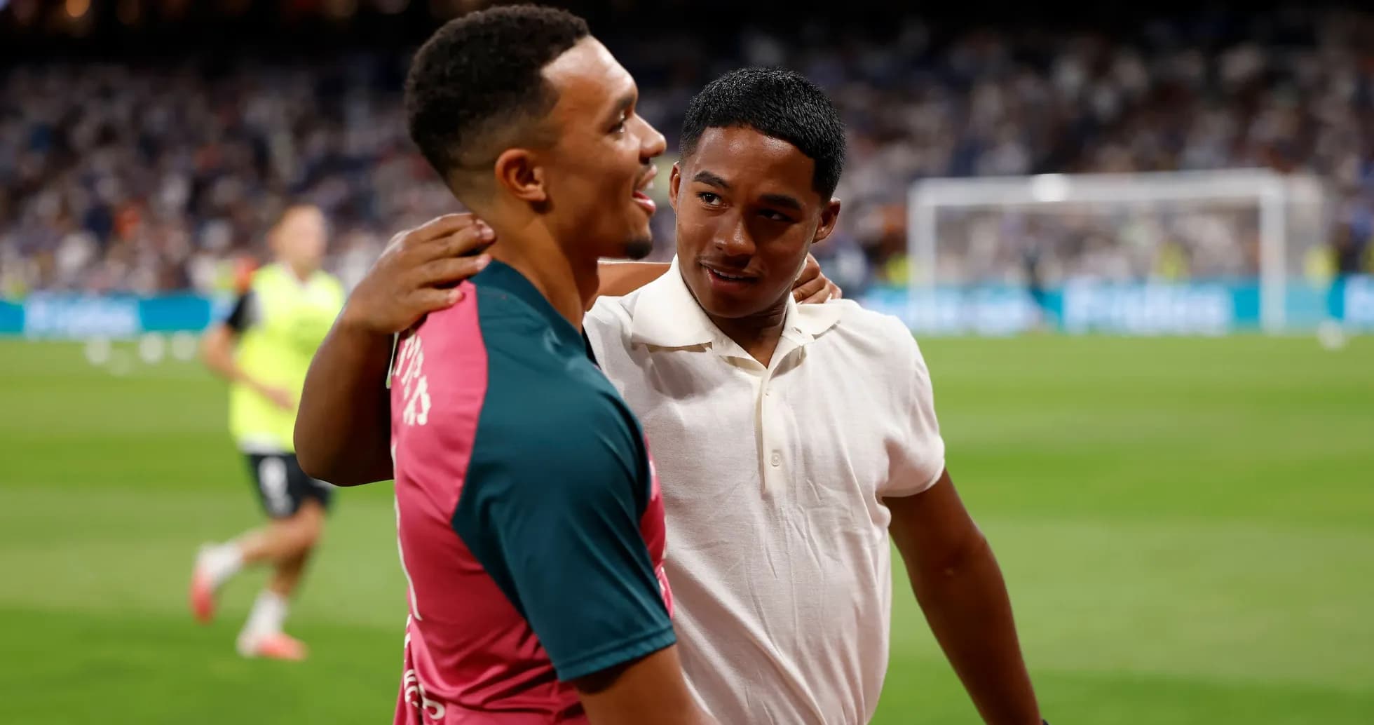 Two players interacting on the pitch before match Two players interacting on the pitch before match