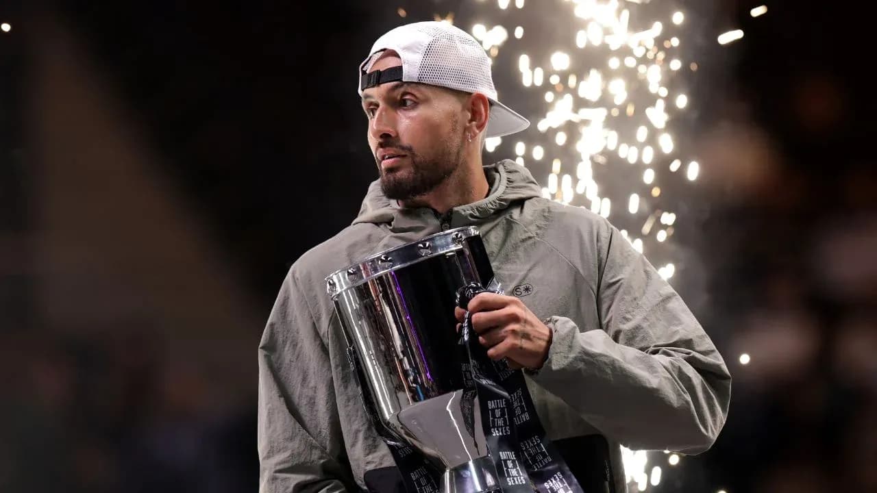 Athlete holding trophy with sparks in background Athlete holding trophy with sparks in background
