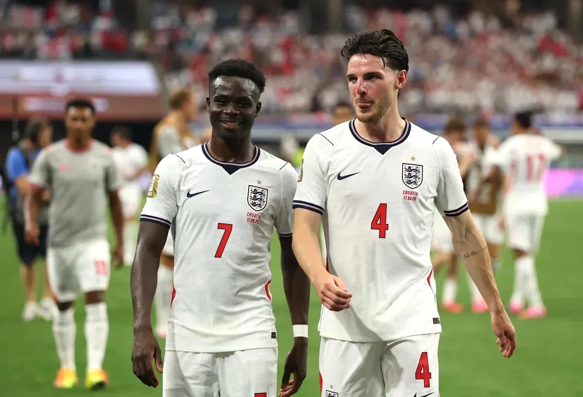Two England players walking off the pitch after match Two England players walking off the pitch after match