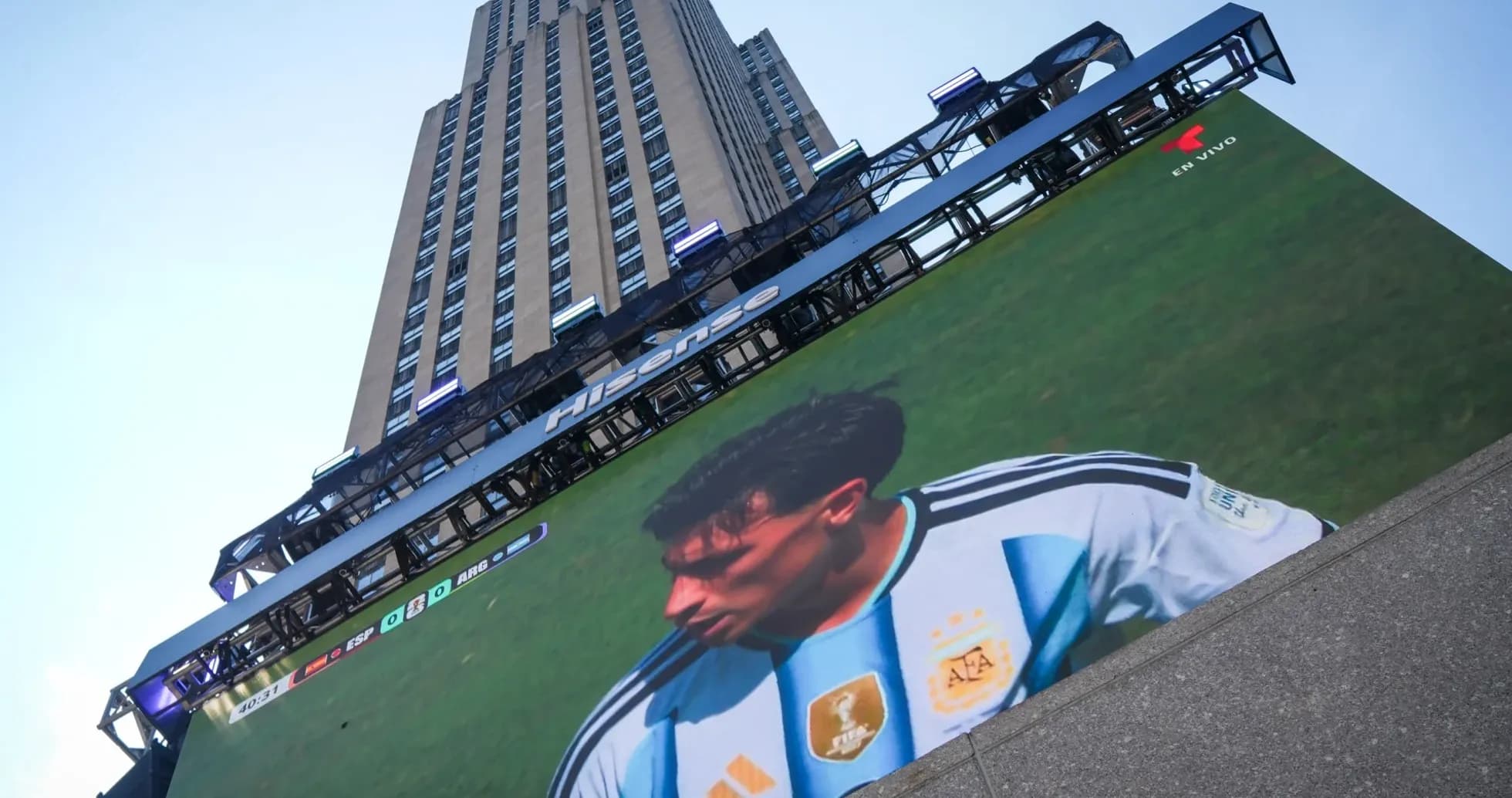 Building with large screen showing football match Building with large screen showing football match