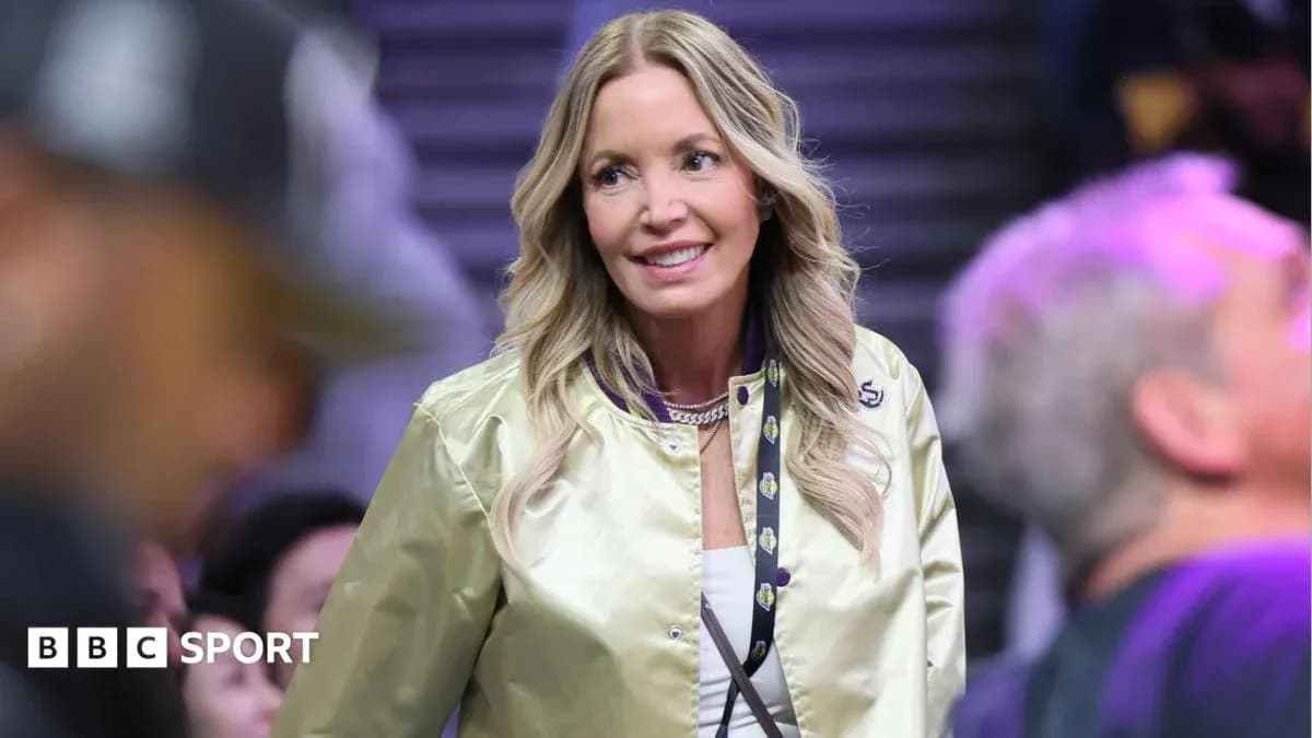 Woman in a gold jacket at a sports event Woman in a gold jacket at a sports event