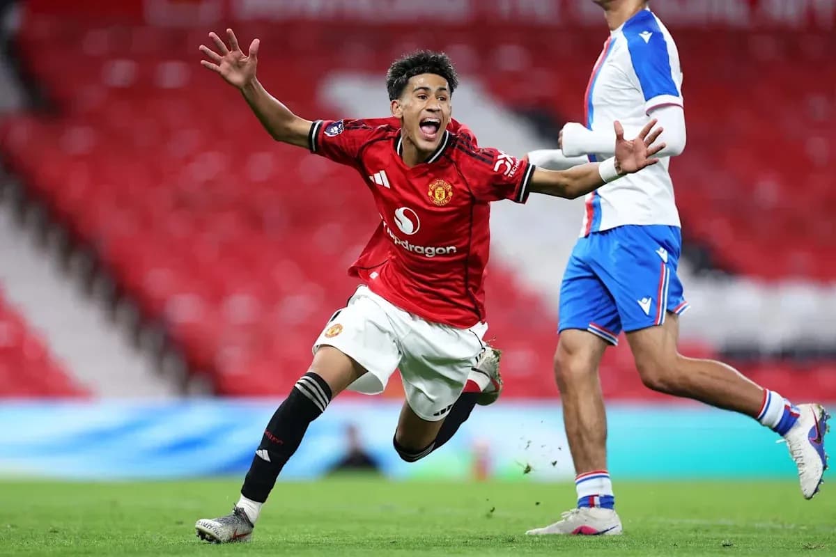 Manchester United player celebrating a goal on pitch Manchester United player celebrating a goal on pitch