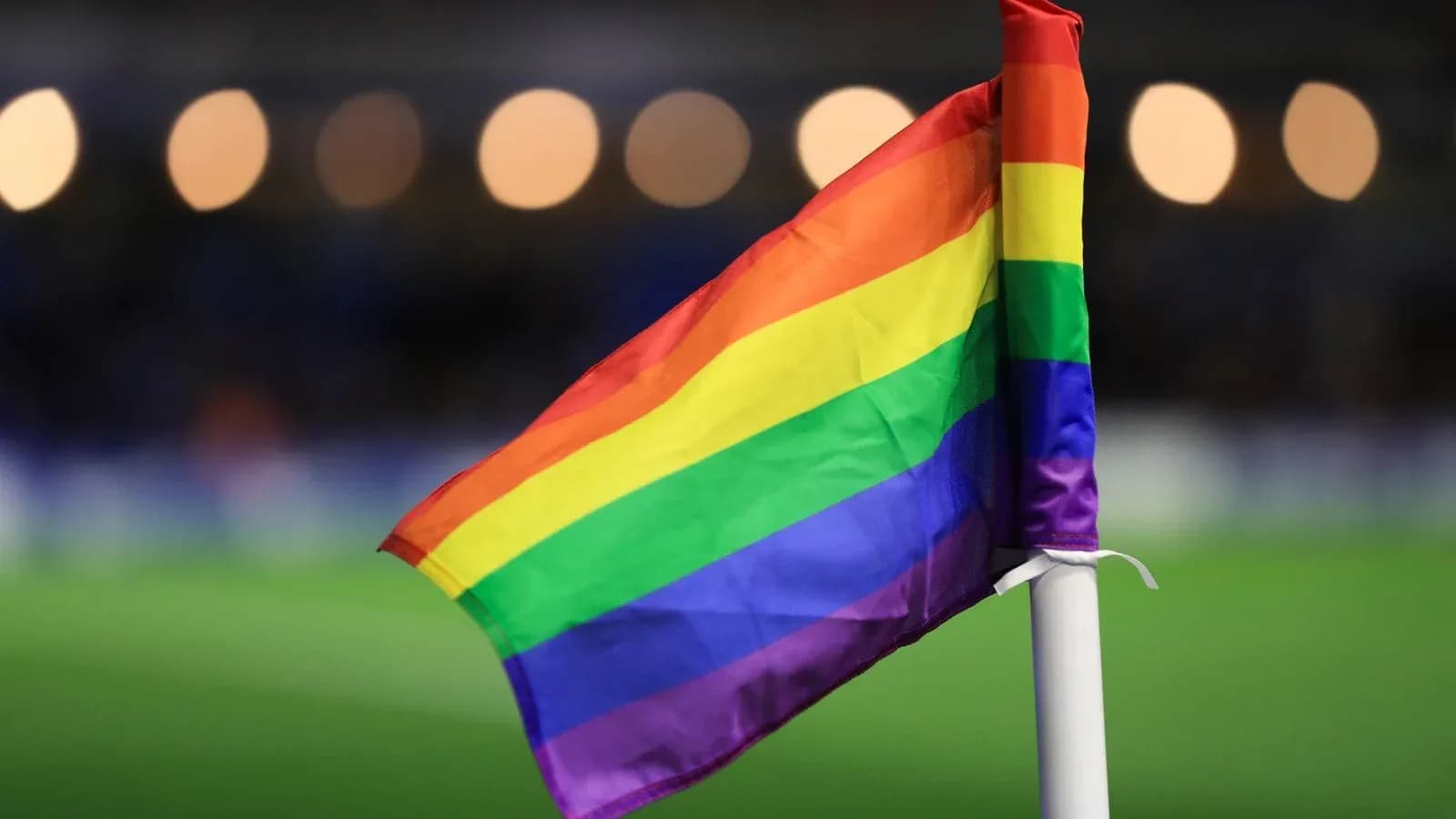 Rainbow flag on corner post at football match Rainbow flag on corner post at football match
