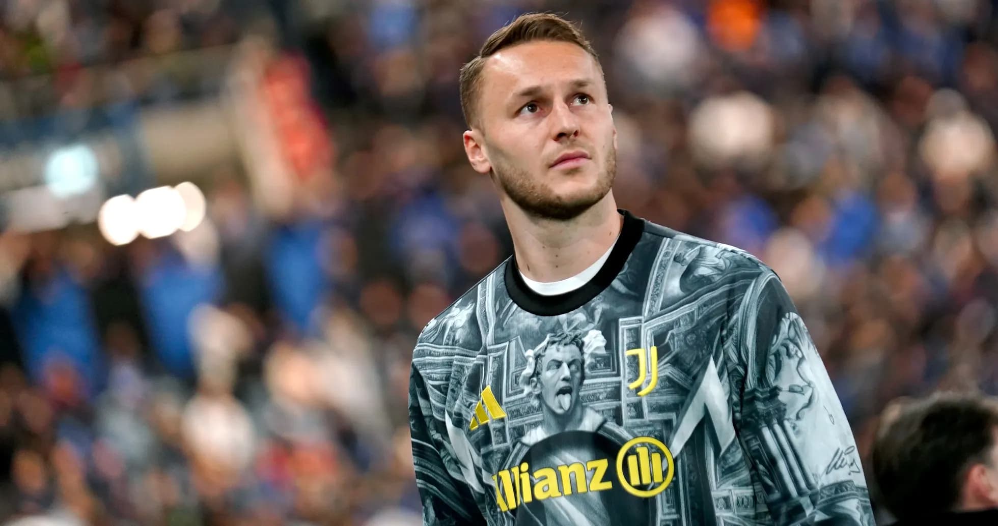 Goalkeeper in Juventus kit looking towards the crowd Goalkeeper in Juventus kit looking towards the crowd
