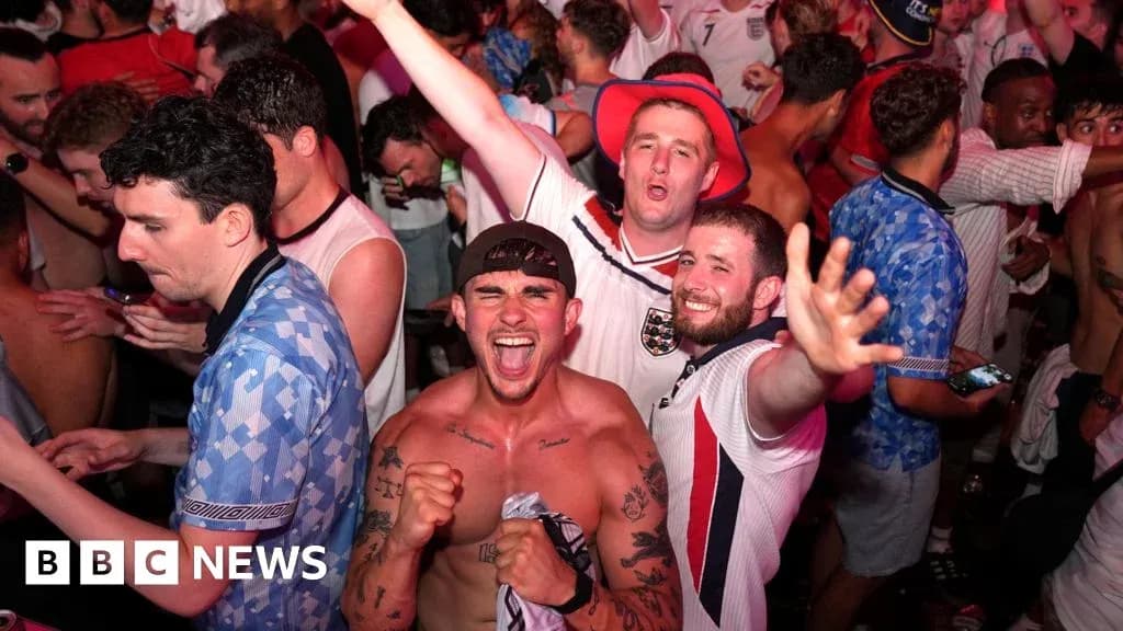 Football fans celebrating in a crowded venue Football fans celebrating in a crowded venue