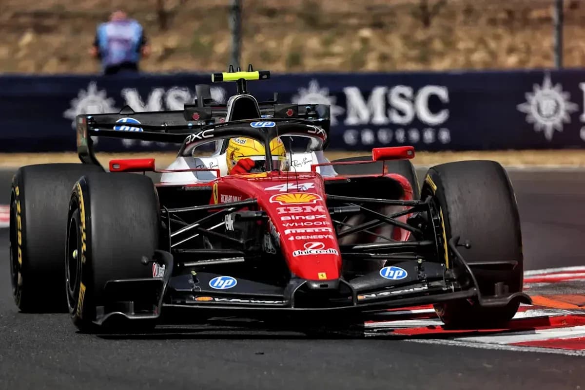 Ferrari F1 car navigating a racing track Ferrari F1 car navigating a racing track