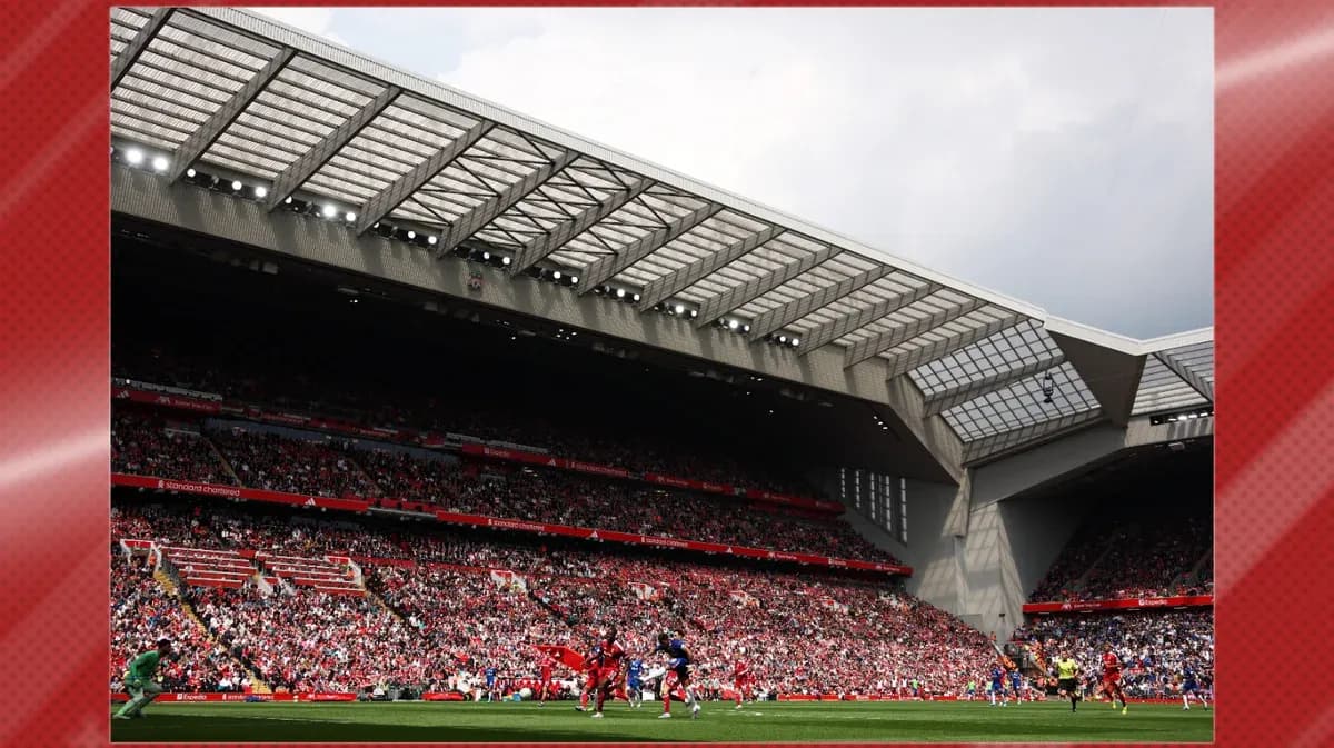 Fans watching match at Anfield stadium Fans watching match at Anfield stadium