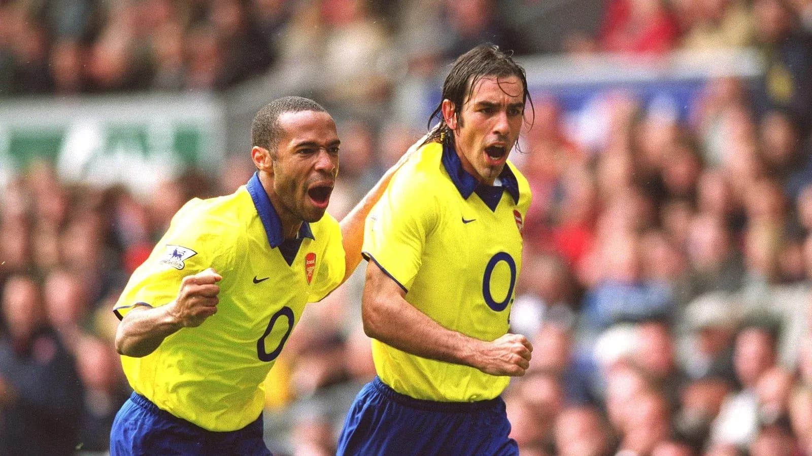 Arsenal players celebrating a goal on the field Arsenal players celebrating a goal on the field