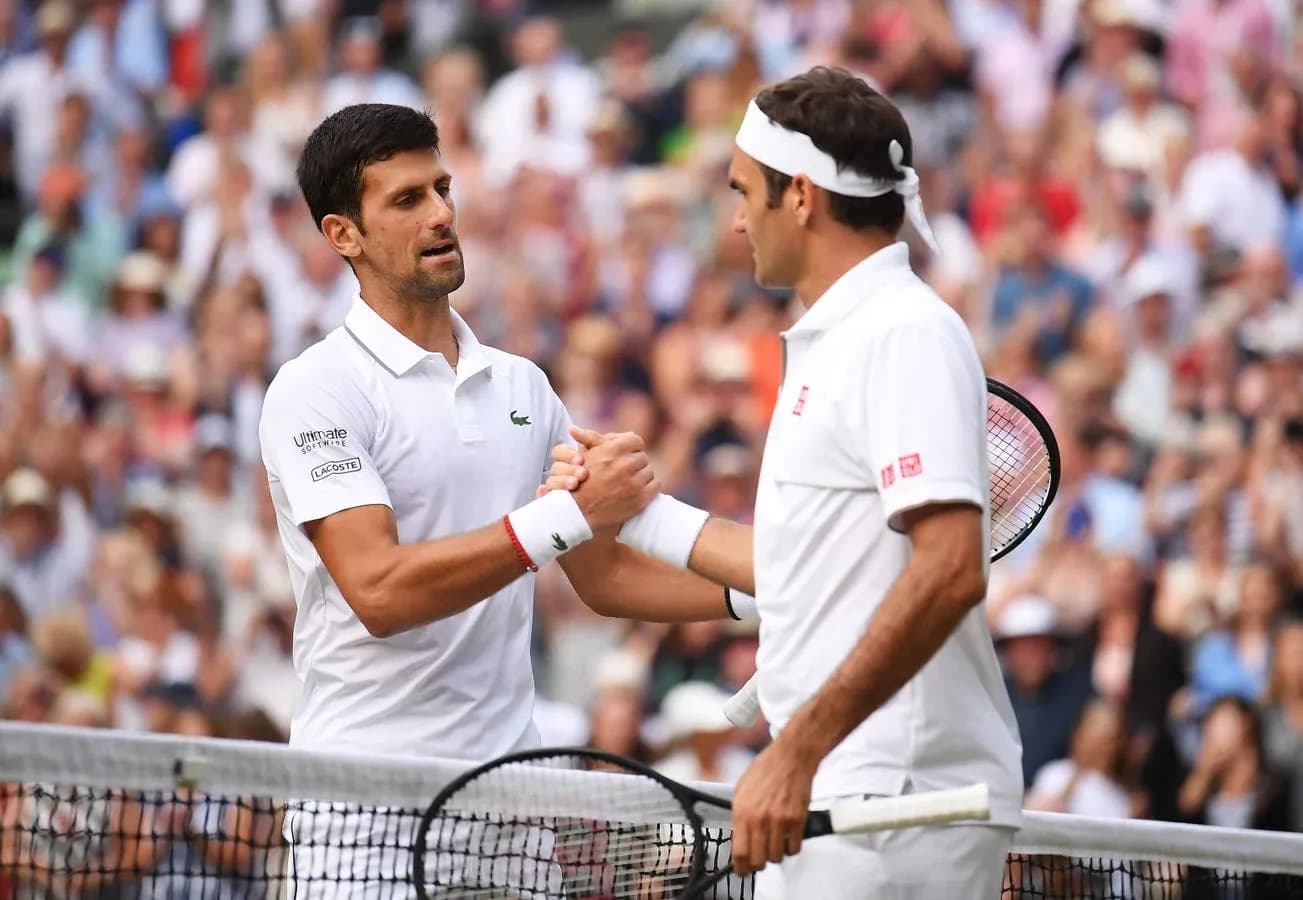 Novak Djokovic and Roger Federer shaking hands after match Novak Djokovic and Roger Federer shaking hands after match