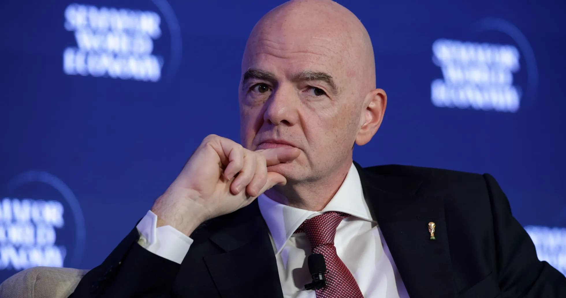 Man speaking at a conference with a microphone Man speaking at a conference with a microphone