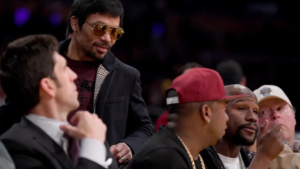 Manny Pacquiao interacting with spectators at event Manny Pacquiao interacting with spectators at event