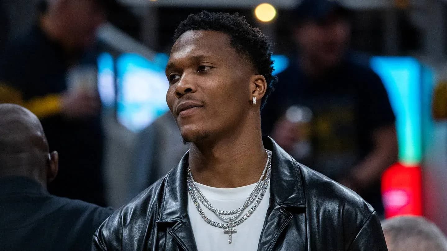 Basketball player wearing jewelry at event Basketball player wearing jewelry at event