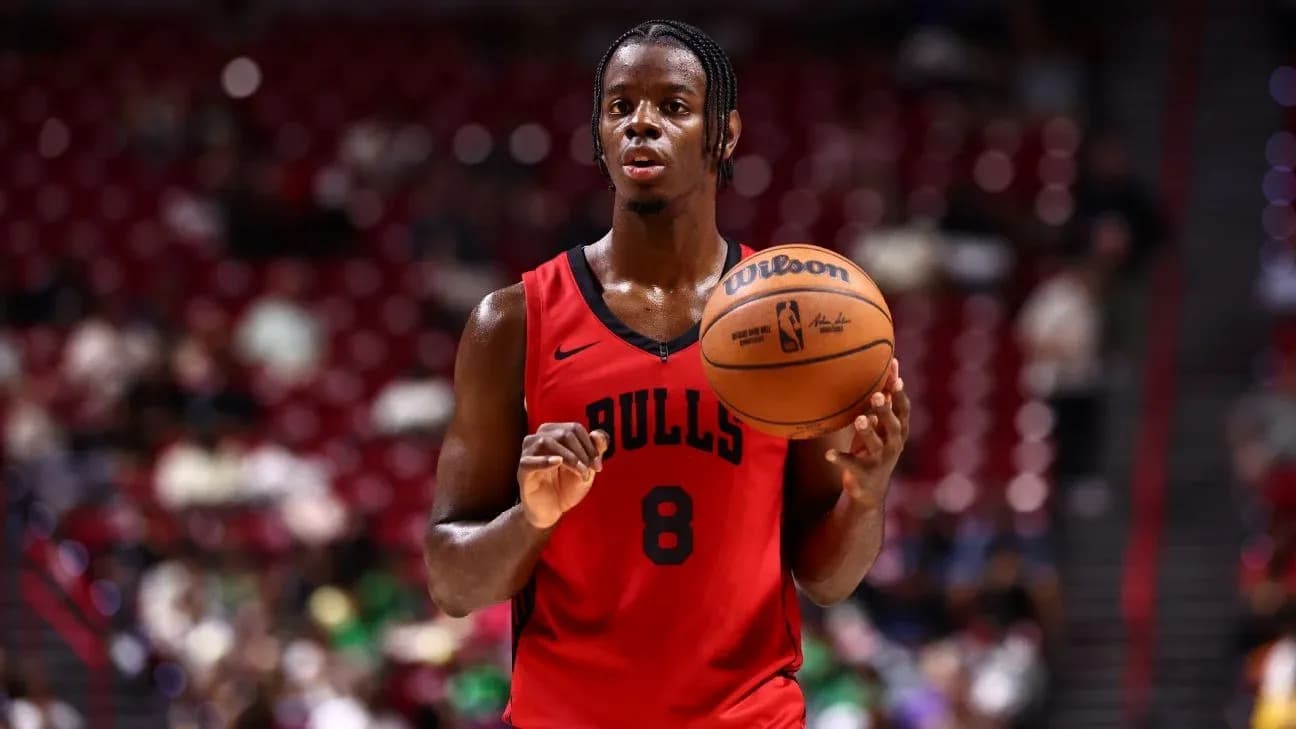 Bulls player holding basketball during game warm-up Bulls player holding basketball during game warm-up