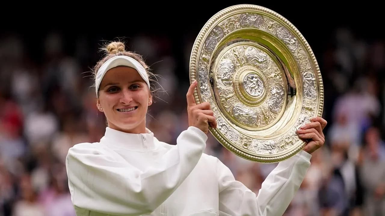 Tennis player celebrating with Wimbledon trophy Tennis player celebrating with Wimbledon trophy