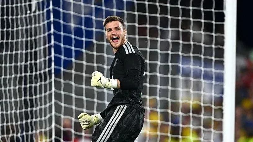 Goalkeeper celebrating after a crucial save Goalkeeper celebrating after a crucial save