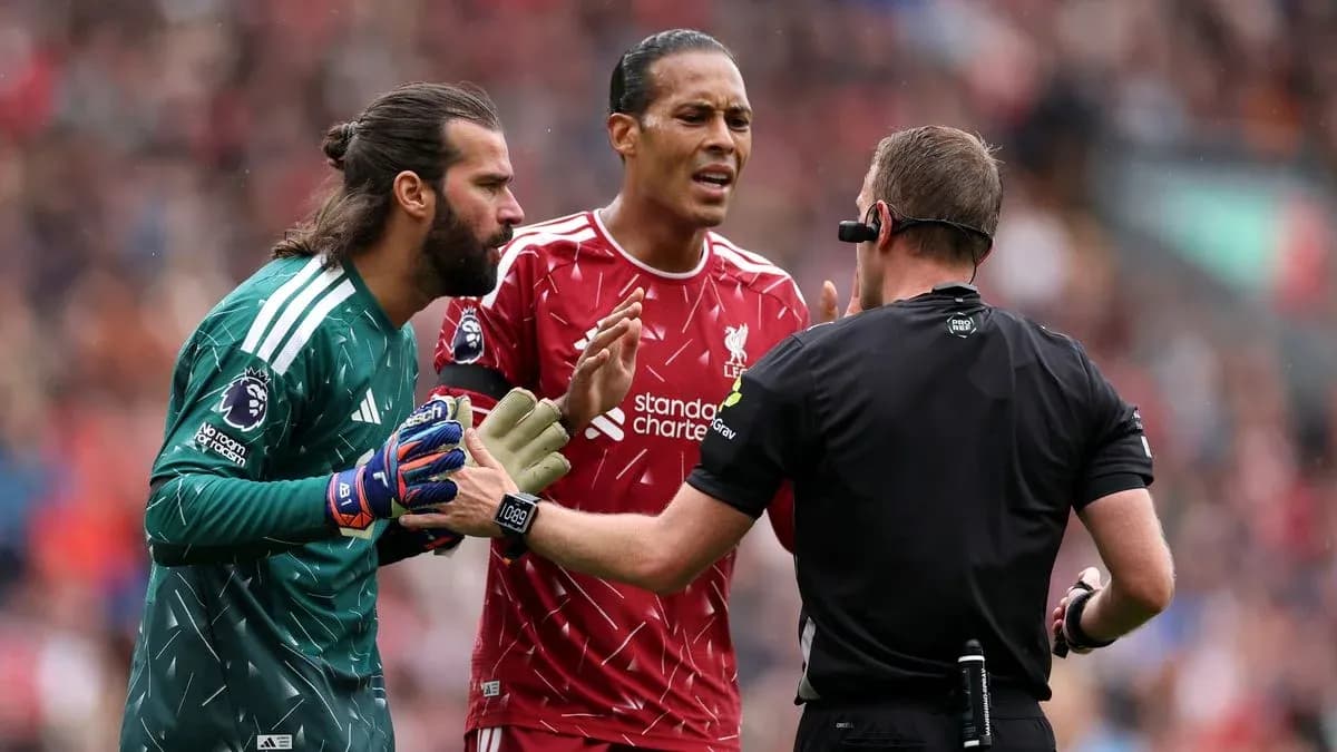 Liverpool players arguing with the referee during match Liverpool players arguing with the referee during match