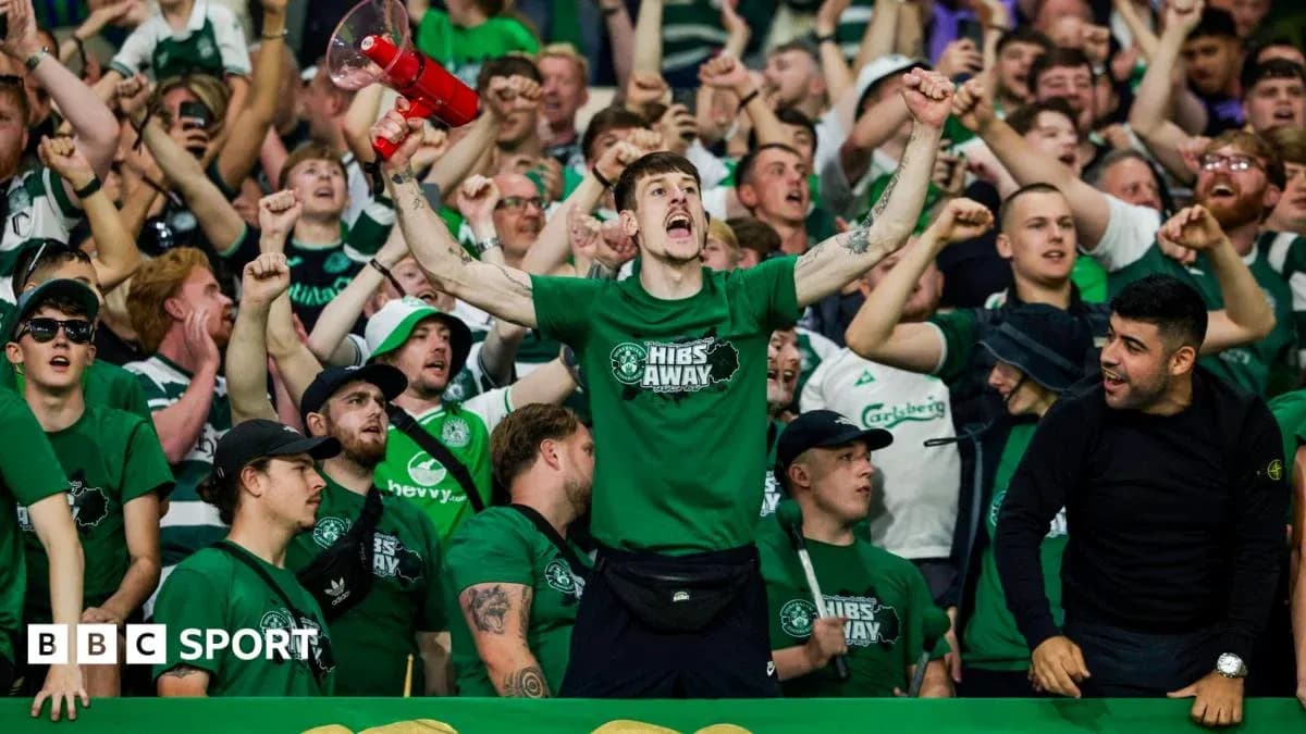 Hibernian fans celebrating with a megaphone Hibernian fans celebrating with a megaphone