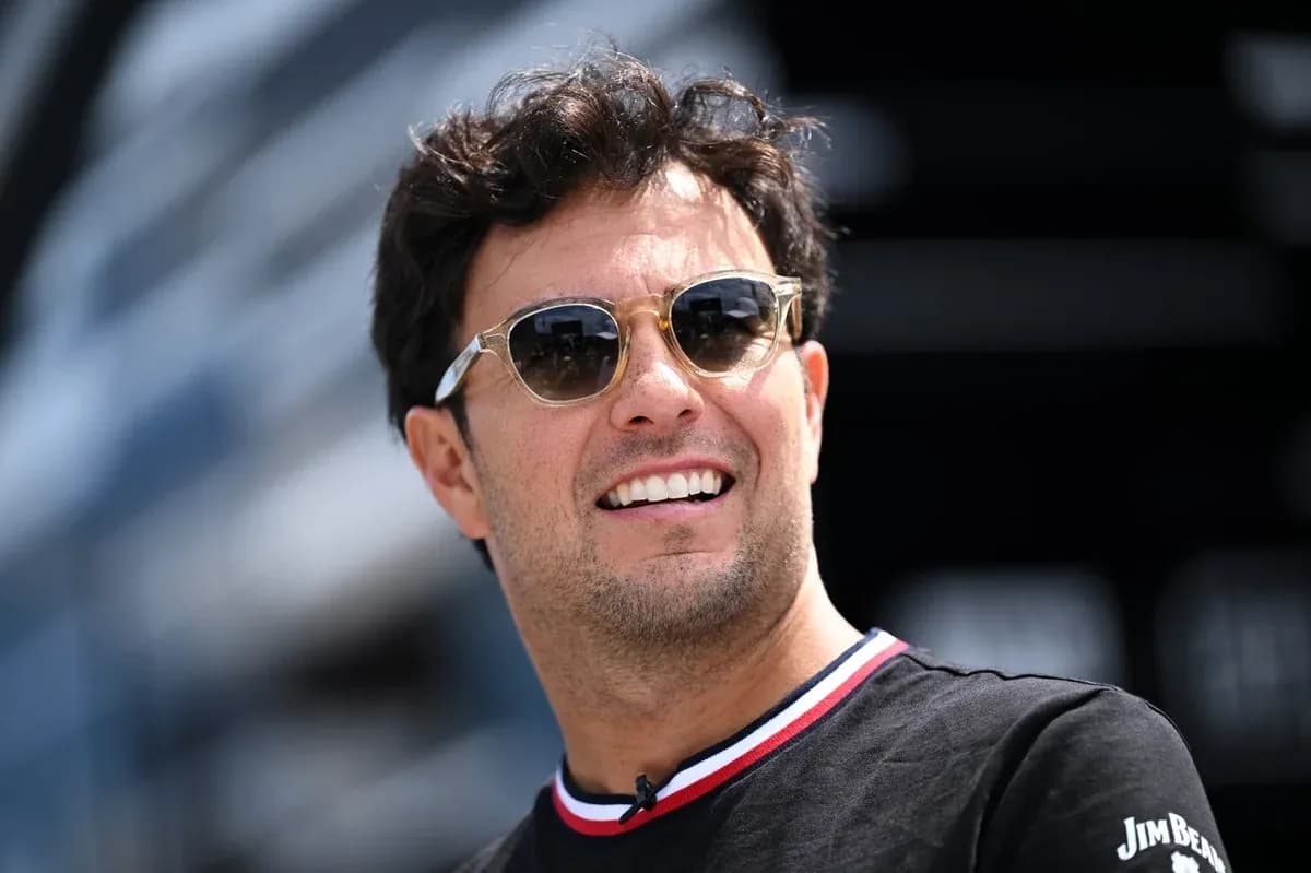 Driver wearing sunglasses at racing event Driver wearing sunglasses at racing event