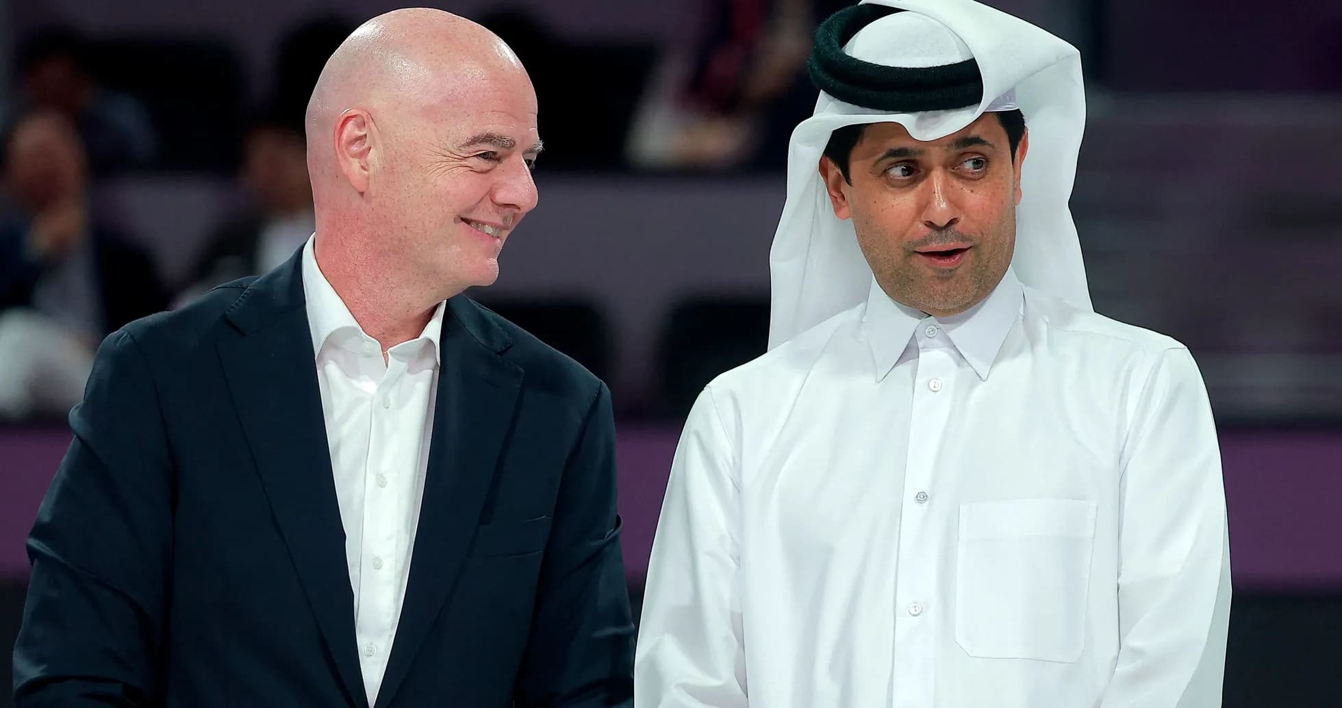 Two men talking at an event in Qatar Two men talking at an event in Qatar