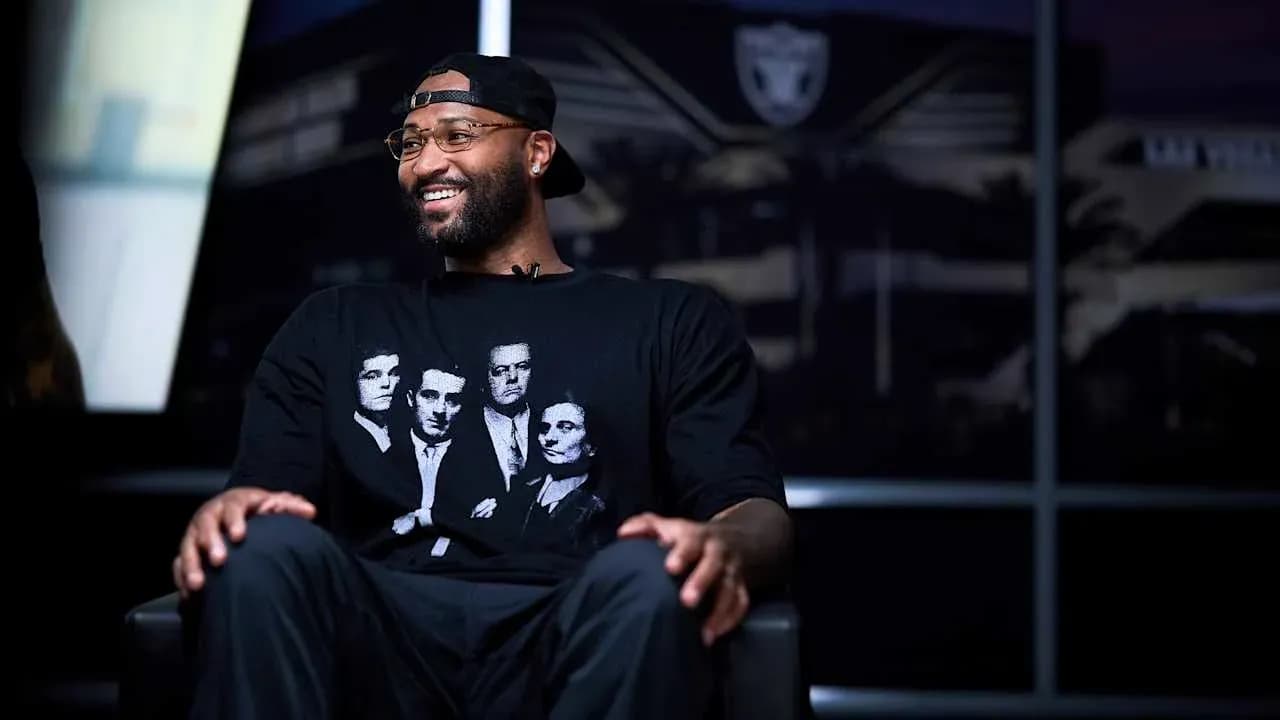 Player wearing black t-shirt during interview setting Player wearing black t-shirt during interview setting